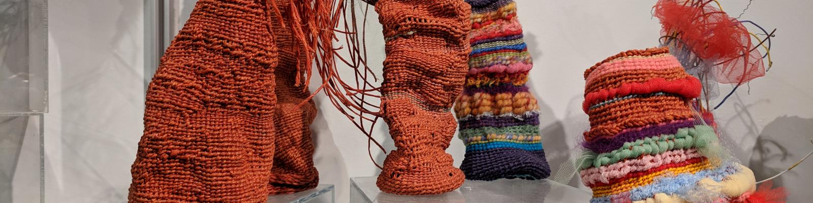 Grouping of woven fiber sculptures