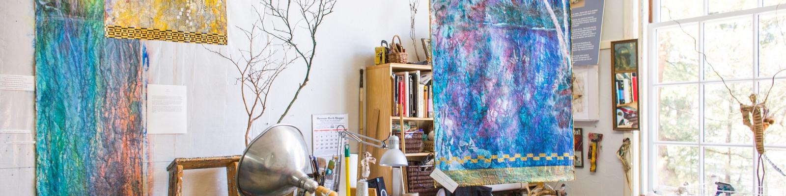 Max Payne art studio with colorful wall hangings