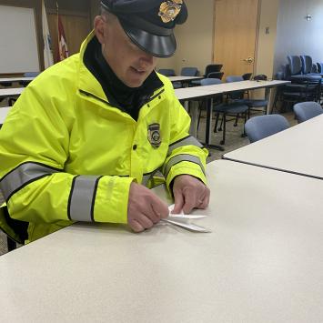 Fireman Making Artfest Dedication Doves by Mary Ellen Harney
