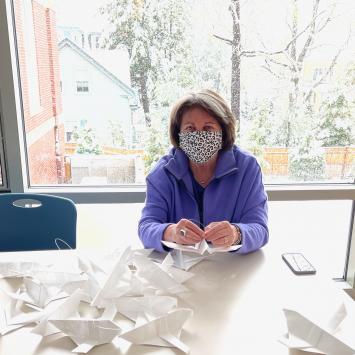 Volunteer Making Artfest Dedication Doves by Ellen McHale 