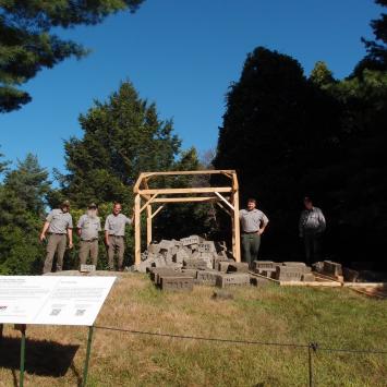 Rangers from the National Park Service help install Nancy Winship Milliken's "Witness" at Minute Man National Park
