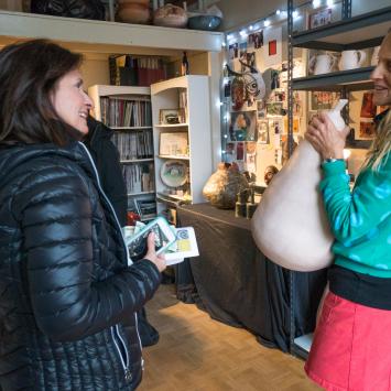 Artist showing ceramic work